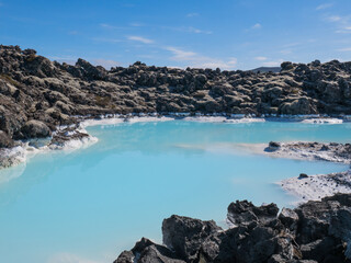 Blue lagoon water in lava field landscape, natural geothermal spa, Iceland © Alena Solonshchikova