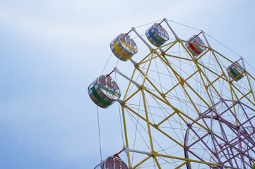 ferris wheel against blue sky