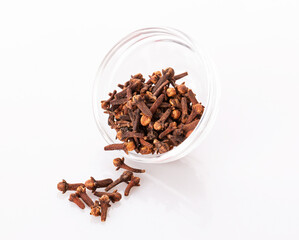 cloves and allspice in transparent bowls, isolated on a white background