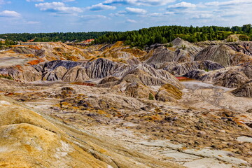 autumn landscape of the space valley with craters and rivers, against a blue sky with clouds and reflections