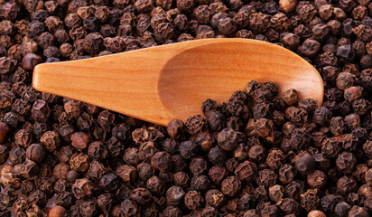 black pepper peas in a wooden spoon and scattered 