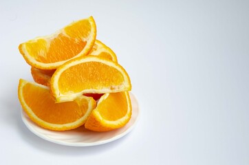 Naklejka na ściany i meble Sliced orange close up, slices of juicy orange. 