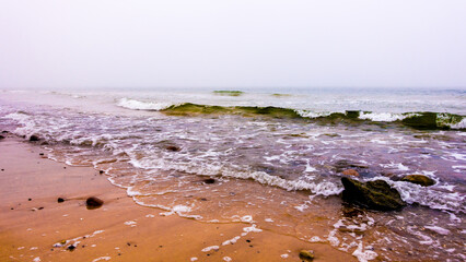 Rocks, stones and waves on the beach of the Baltic Sea
