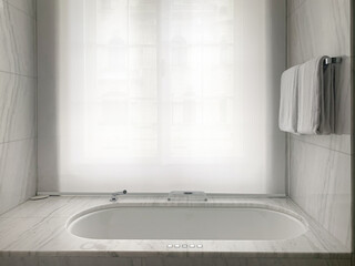 White luxury bathtub, bathroom with marble walls 
