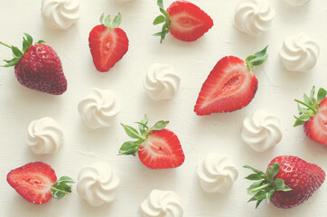 Pattern with strawberries and meringues on white background