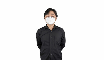 Asian middle man in a black shirt, wears a white n95 mask, stands in front of a white clear background.