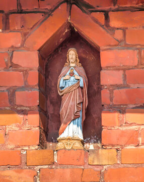 a figurine of the heart of Jesus in the wall of an old building in Kalety-Zielona in Poland