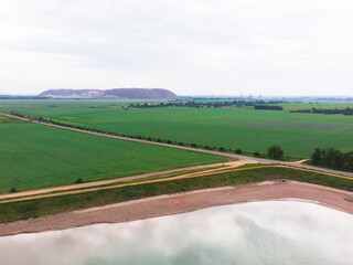 salt piles among the green fields. the view from the top