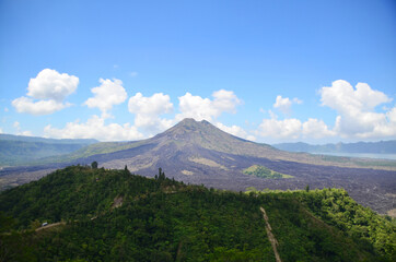 Obraz na płótnie Canvas Mount Batur (or The Kintamani Volcano) is an active volcano and a very popular trek. The captivating Mount Batur surrounds the 13-sq-km Batur caldera lake.