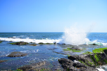 Tanah Lot is a rock formation off the Indonesian island of Bali. It is home to the ancient Hindu pilgrimage temple Pura Tanah Lot, a popular tourist and cultural icon for photography.