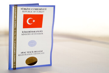 Car key and Turkish registration licence on isolated background close up view