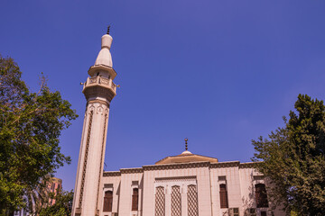 beautiful mosque on a background of clouds around the greens