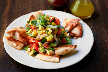 Fototapeta na wymiar Salad with vegetables and croutons, white plate