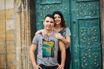 young couple posing on city background, travel concept