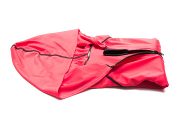 Folded red zipper windbreaker jacket, UV sun proof outdoor jacket hoodie. Track jacket sport hoodie full zip isolated on white background. Folded clothes.