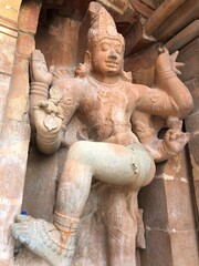 Fototapeta na wymiar Stone statue of Hindu God in Brihadeeswar temple in Thanjavur, Tamil nadu