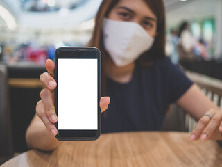 women holding smartphone and show screen of smartphone, blank screen.