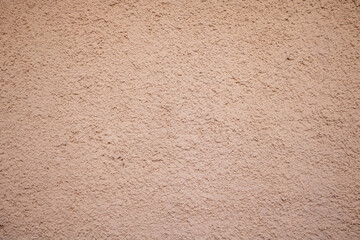 Brown, beige color, rough plaster wall background texture