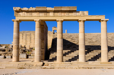 Fototapeta premium Sightseeing of Rhodes island. Ruins of ancient temple in Lindos, Rhodes island, Greece.