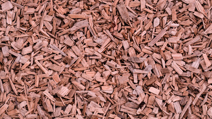 Crushed cedar tree bark texture background closeup. Pieces of trunk. Old tree bark background or...