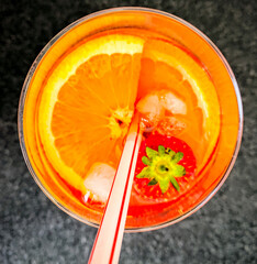 Refreshing drink with oranges and strawberries