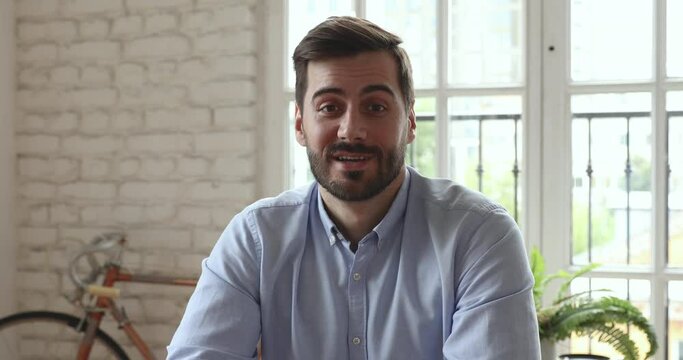 Confident businessman business coach speak look at camera in office, male entrepreneur talk during conference online call job interview recording online training webinar videoconference, webcam view