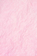 Pink wrinkled textured paper background with lace overlay