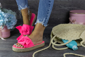 Woman posing in stylish beach sandals. Beauty and Fashion summer concept