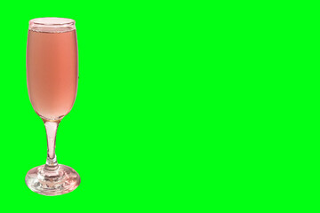Red wine in glass. Isolated on green background
