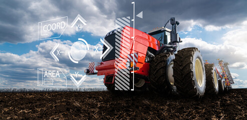Autonomous remote controlled agricultural tractor on the field. Digital transformation in...