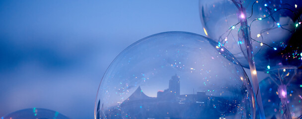 city reflection in Transparent inflatable balls close-up in evening