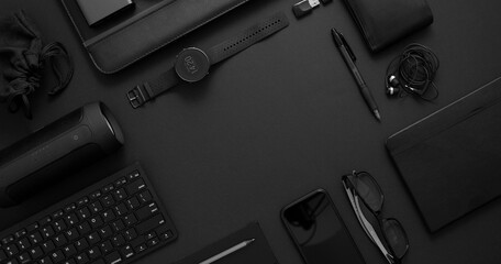 Business concept. Flat lay composition with various black gadgets on dark black surface - Powered by Adobe