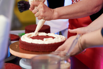 Obraz na płótnie Canvas process of preparing cake red Velvet with women hands