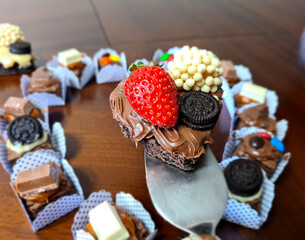 Delicious heart-shaped brownie with hazelnut cream, strawberry and white chocolate candy. Perfect for birthday, Valentine's day or other dates.