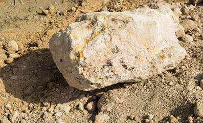 Large laterite soil. red earth.Big stone in road construction site.