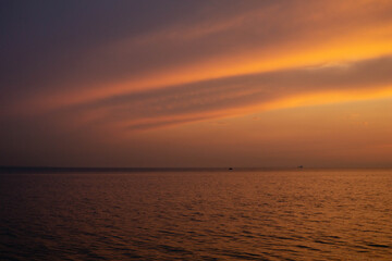 Naklejka na ściany i meble evening sunset over the sea