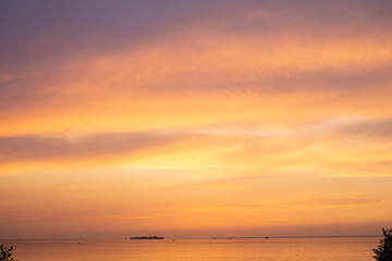 Naklejka na ściany i meble sunset over the sea and clouds