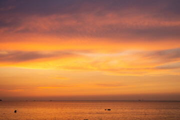 sunset over the sea and clouds