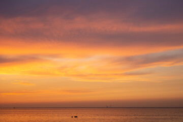 sunset over the sea and clouds