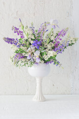 summer bouquet iin white vase  on white background