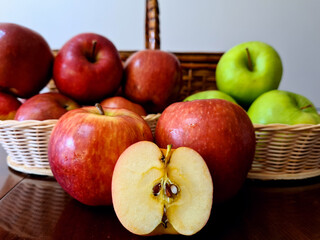 Very delicious and healthy apples, displayed in a beautiful basket for a pleasant picnic.