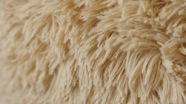 Slow tilt over the brown teddy bear surface 4K footage