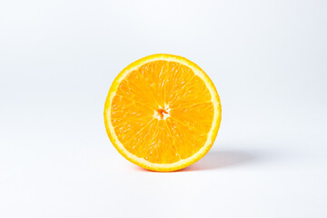 Orange cut in half. An orange on a white background.