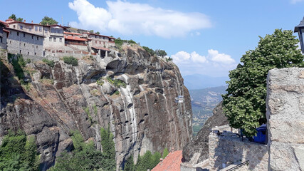 Holy Monastery of the Great Meteoron, Greece, summer 2019. It is located in Meteora, where the monasteries are on giant rocks. In the background you can see a cable car