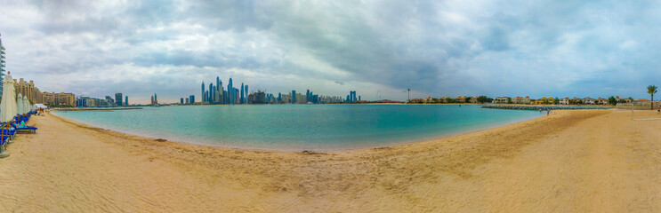 Naklejka premium Dubai Marina panoramic view from Palm Jumeirah beach, Dubai, United Arab Emirates
