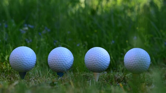 Golf balls that symbolize when one falls so everyone follows along with the stock market downturn and the pandemic in society.