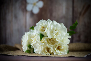 bouquet of beautiful white roses on table