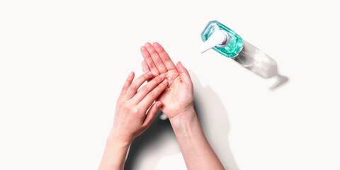 Applying sanitizer gel - healthcare and hygiene concept