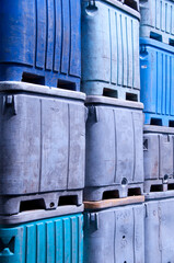 Storage containers stacked on a dock.
