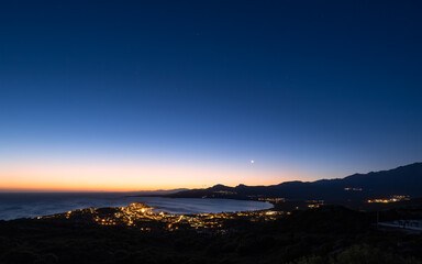 Moon rising over Calvi Bay in Corsica